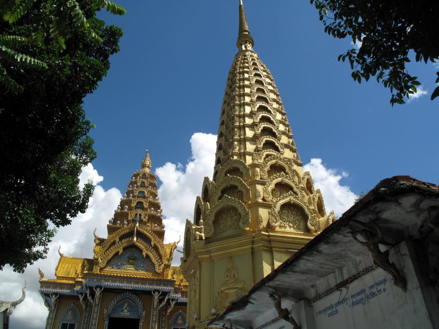 The golden spires of the new temple on Phnom Sampeau