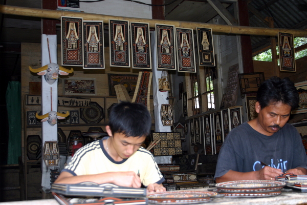 Father and son craftsmen at the woodworkers village