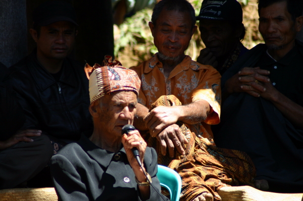 The village headman speaks at the funeral