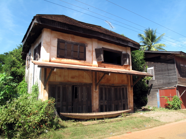 Run-down old shophouse in Champasak