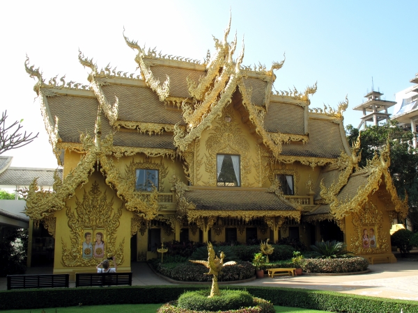 The one gold building of the complex - the toilet