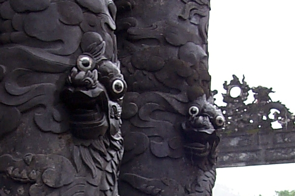 Googly eyes of the dragons wrapped around the columns of the stele pavilion
