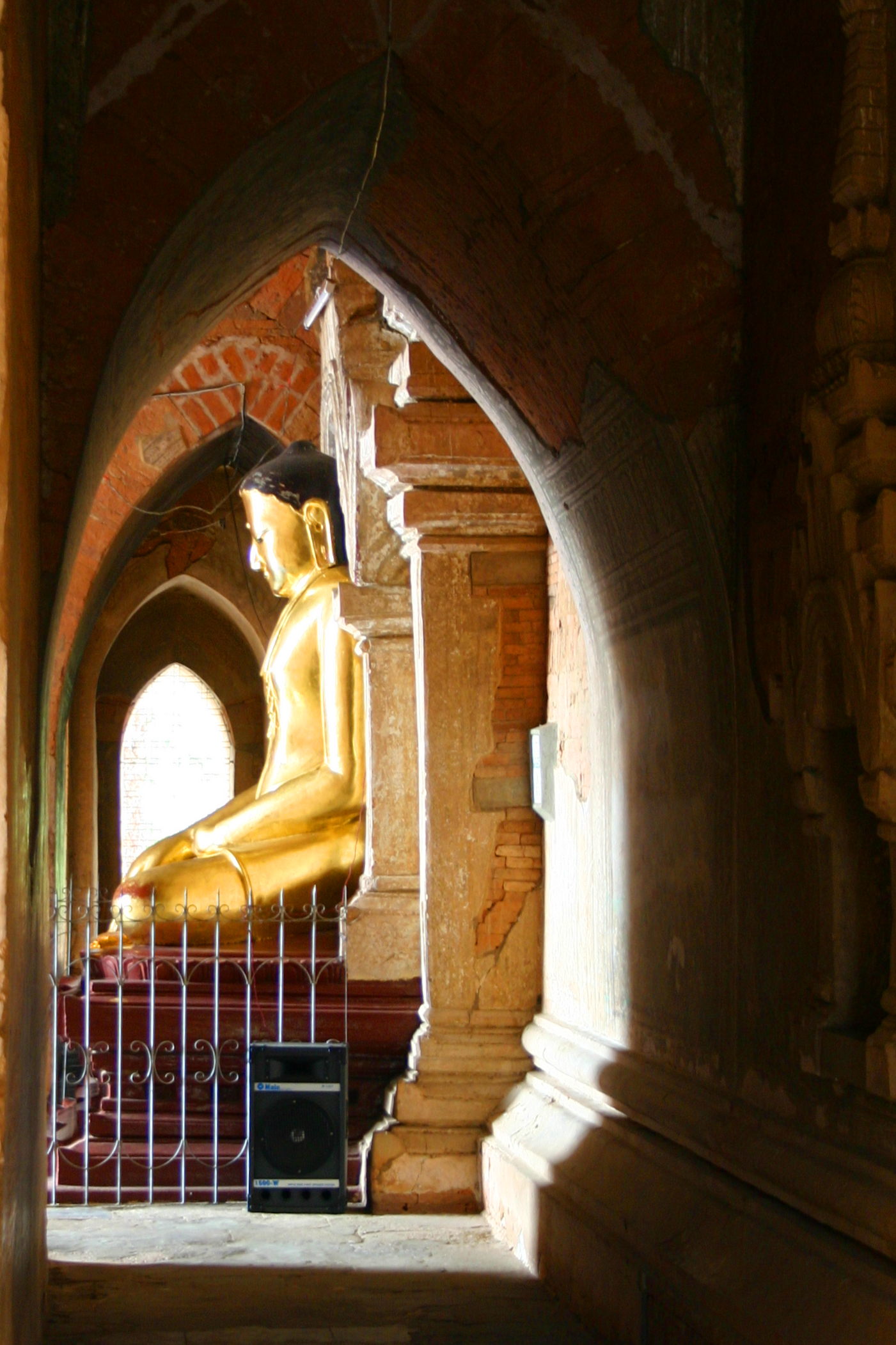 One of the Buddha images in the temple, lit from the sun streaming through an entrance