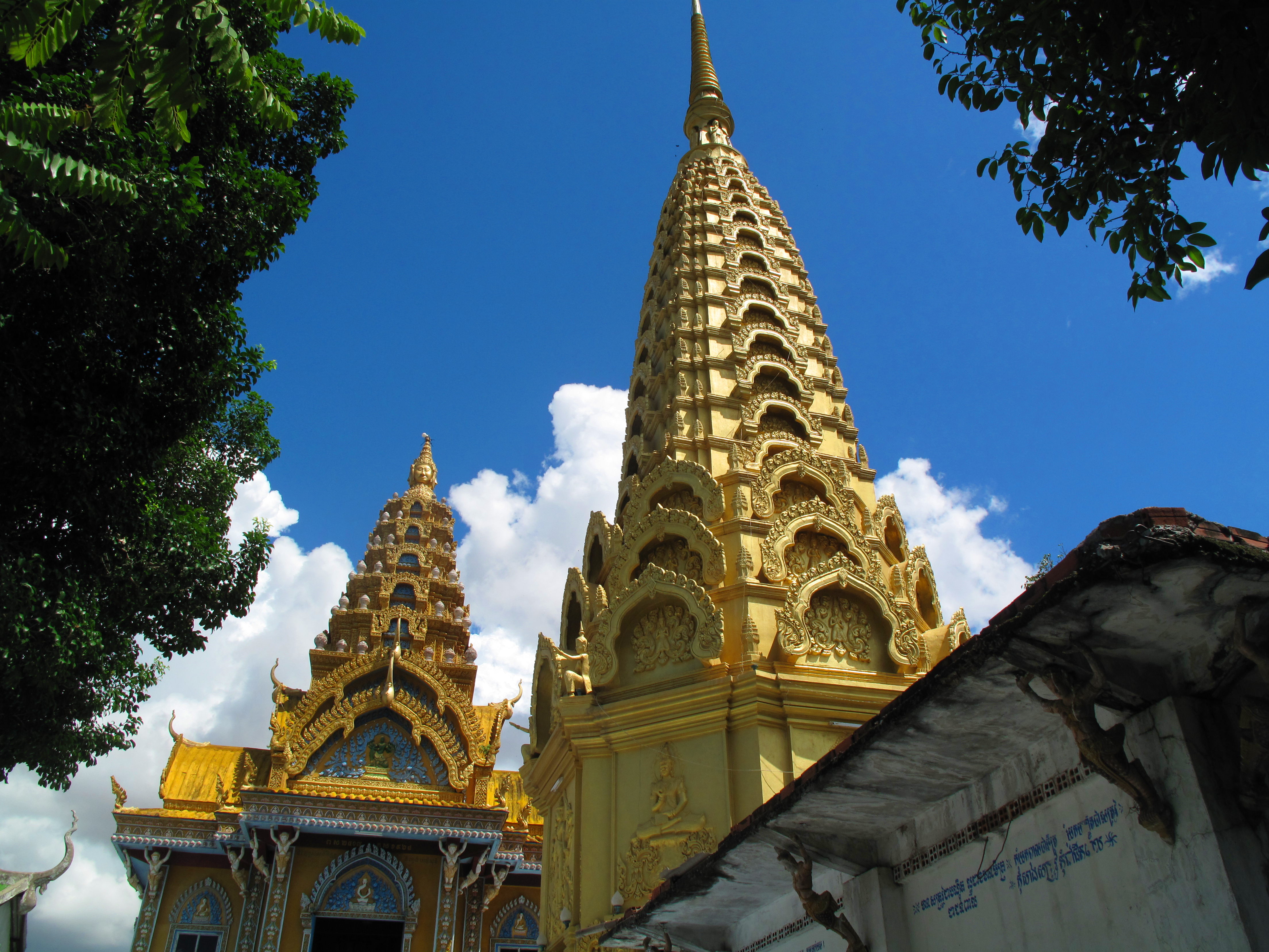 The golden spires of the new temple on Phnom Sampeau