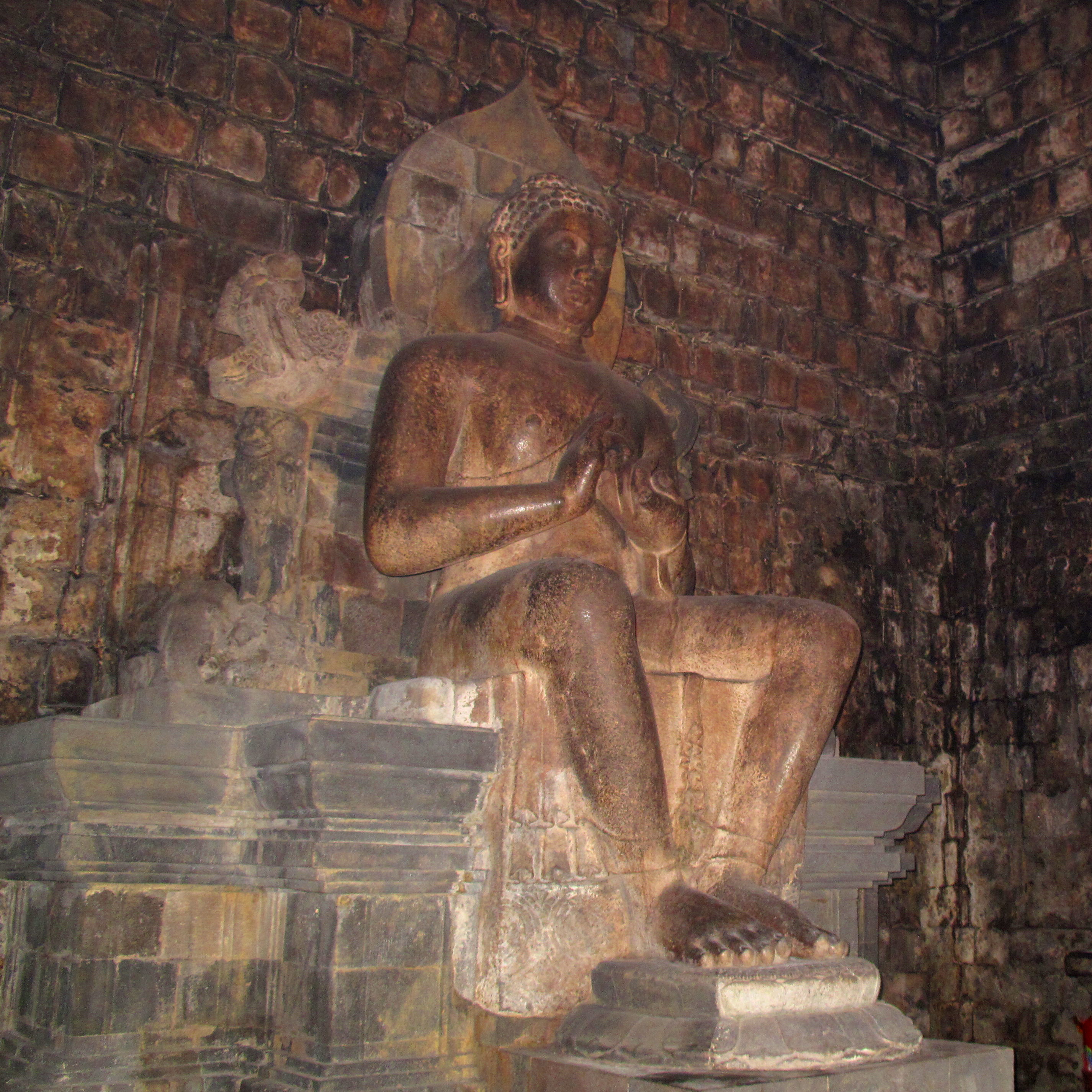 The central seated Buddha image within Mendut temple.