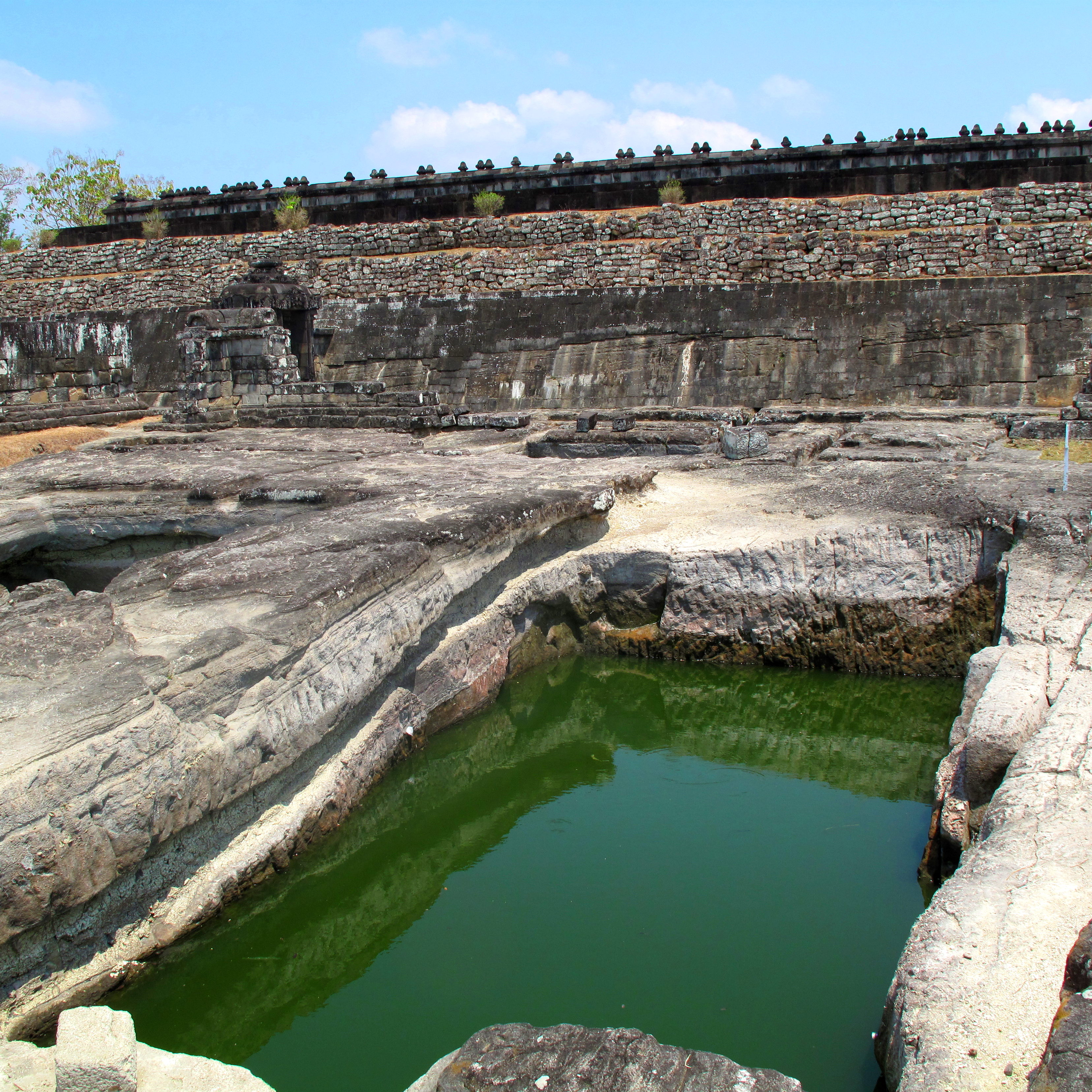 The rectangular pool with the pendopo in the background