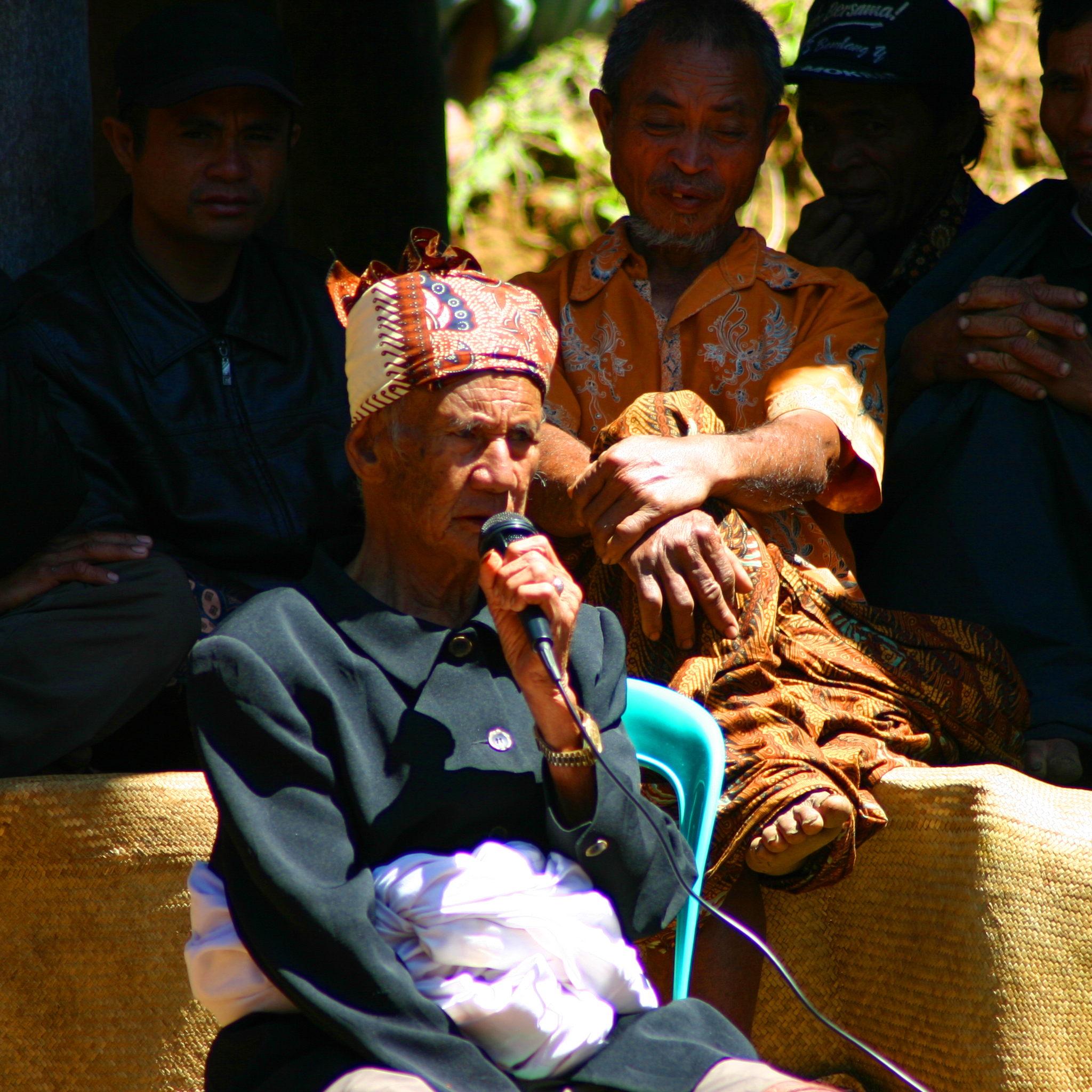 The village headman speaks at the funeral