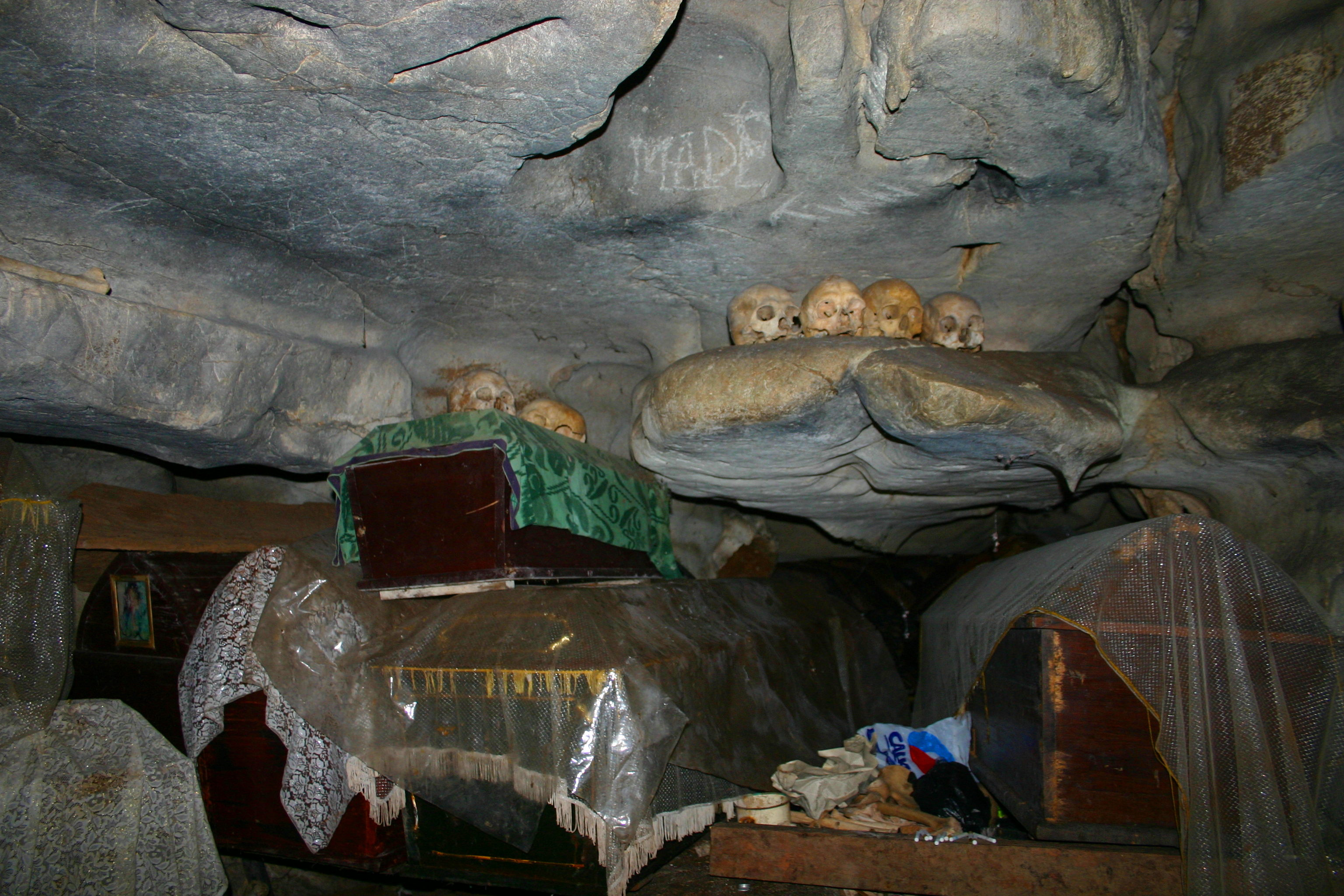 Coffins and skulls in the cave at Londa