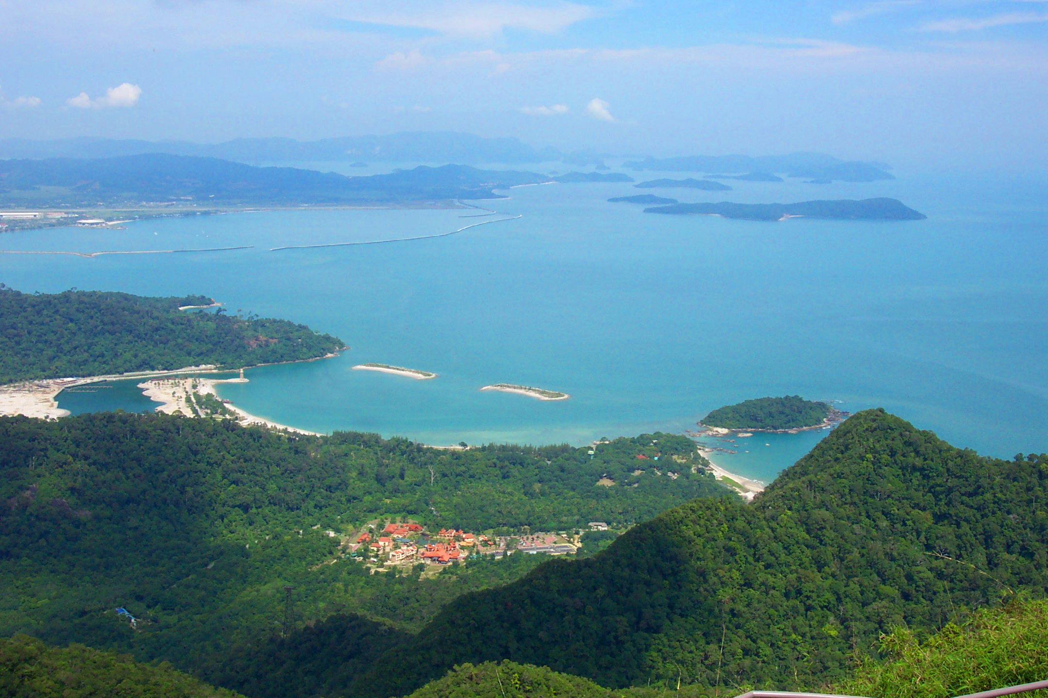 View from the top, looking towards the airport. The Oriental Village and cable car base station is at the bottom middle.