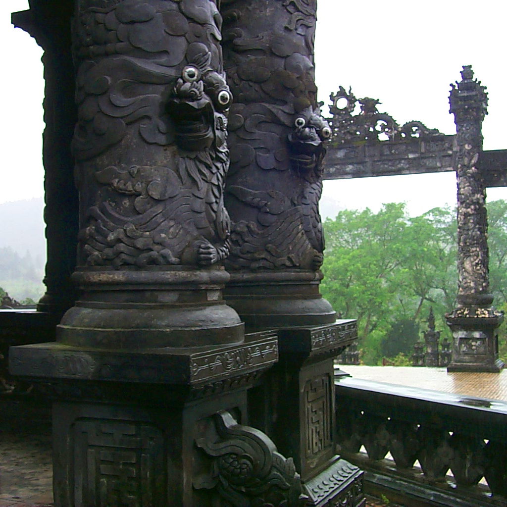 Googly eyes of the dragons wrapped around the columns of the stele pavilion